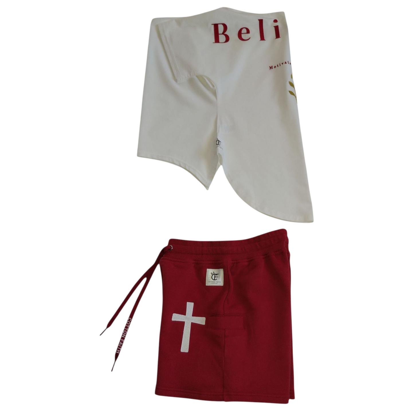 Left side view of white ‘Believer’ shirt and red shorts with white cross and Cotton Faith logo patch.