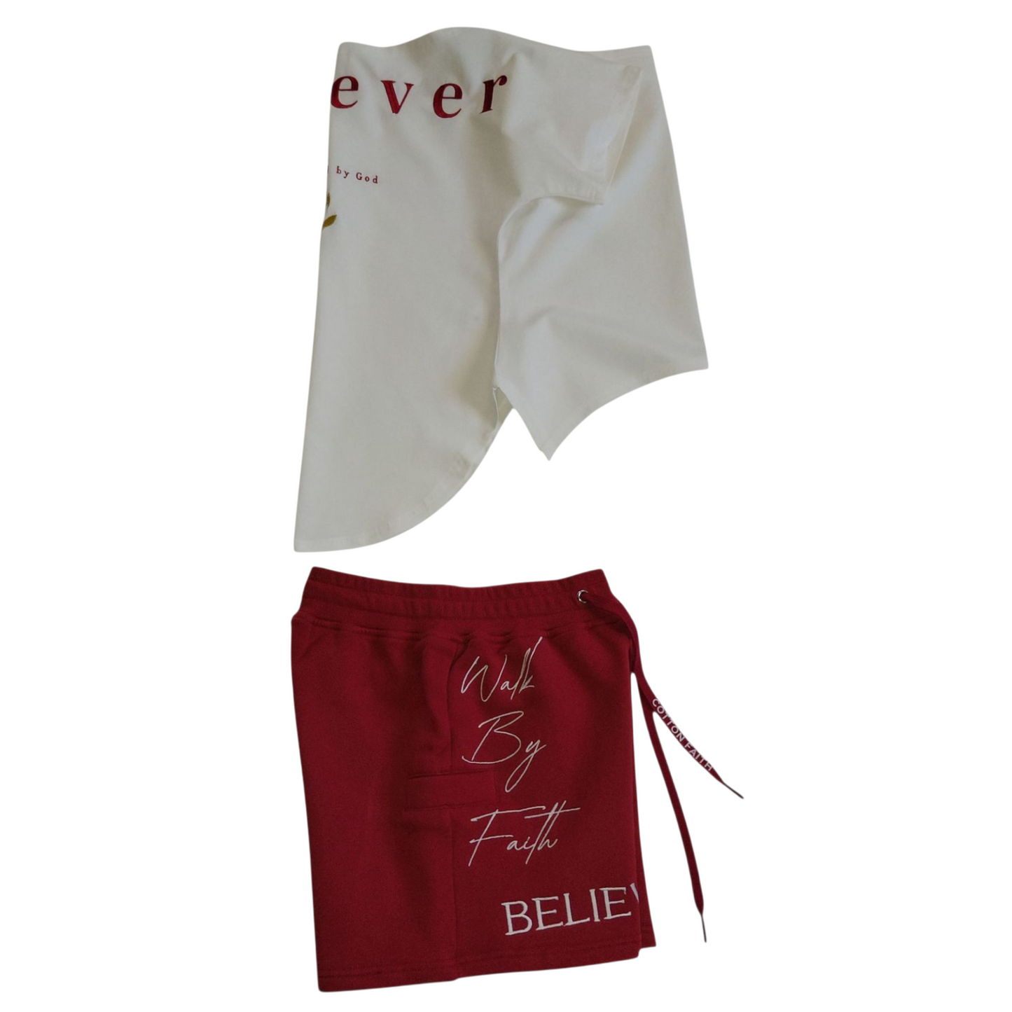 Right side view of white ‘Believer’ shirt and red shorts with ‘Walk By Faith’ and ‘Believer’ text on the front.
