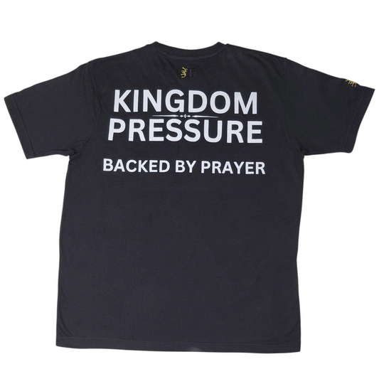 Back view: Black T-shirt with bold “Kingdom Pressure – Backed by Prayer” lettering, Christian-inspired apparel.