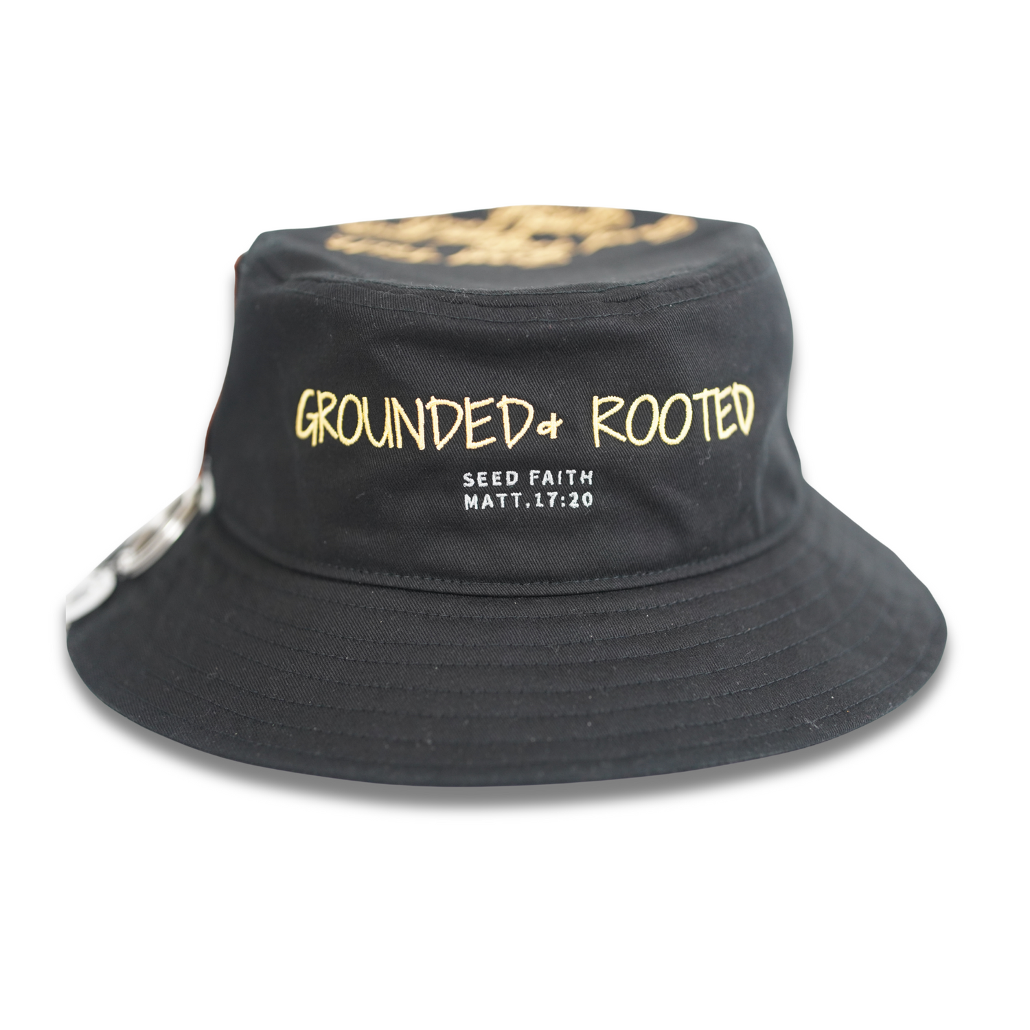 Black bucket hat with “Grounded & Rooted” and Matthew 17:20 embroidered in gold by Cotton Faith – Mustard Collection.