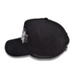 Side view of the Kingdom Heritage black suede hat featuring a raised silver metal lion-on-the-cross emblem attached near the front panel, with embroidered “Kingdom Heritage” logo.