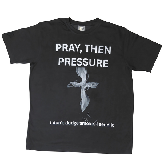 Front view: Black T-shirt with “Pray, Then Pressure” and smoke-cross design, faith-based streetwear by Cotton Faith.